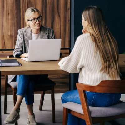 Woman professional HR interviews a candidate for a vacancy